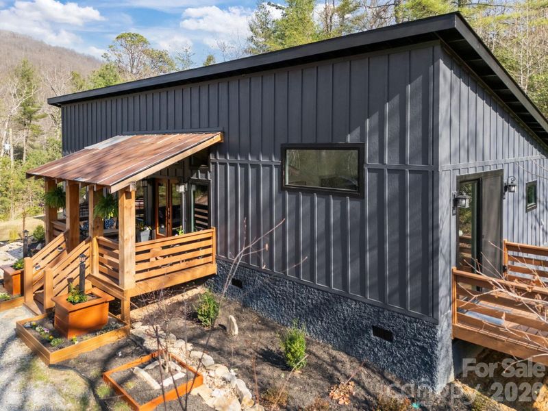 Exterior details and patio area of a home in , Black Mountain (Image 19).