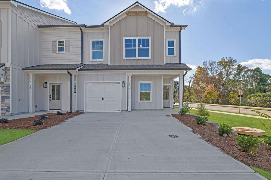 Front exterior of a new home in , Ball Ground, GA, highlighting curb appeal (Image 2). Front exterior of a new home in , Ball Ground, GA, highlighting curb appeal (Image 2).