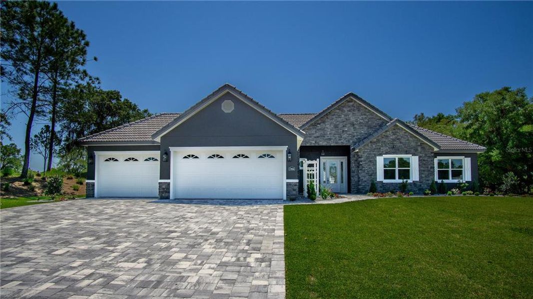 Front exterior of a new home in , Dunnellon, FL, highlighting curb appeal (Image 1).