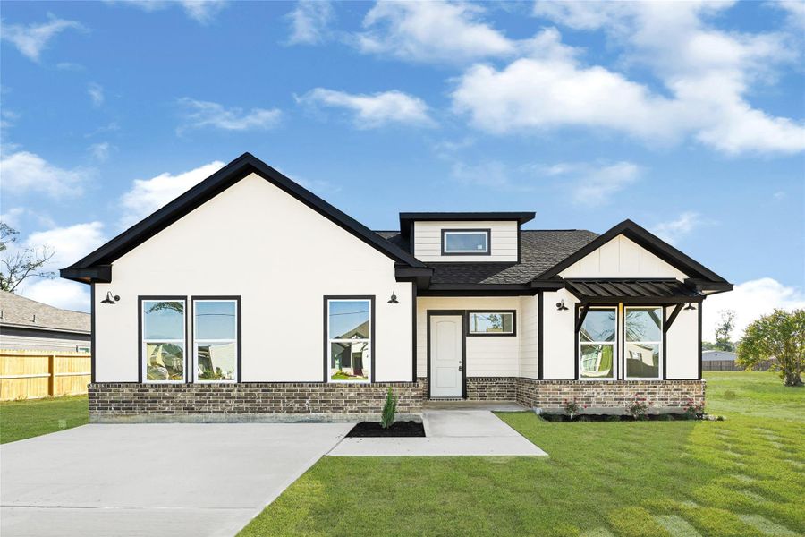 Front exterior of a new home in , Huffman, TX, highlighting curb appeal (Image 24).