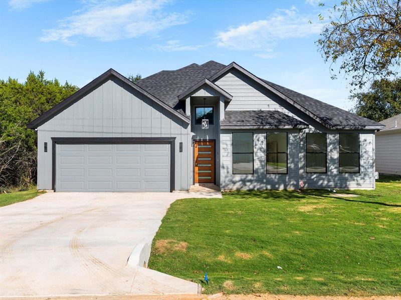 Front exterior of a new home in , Granbury, TX, highlighting curb appeal (Image 1).