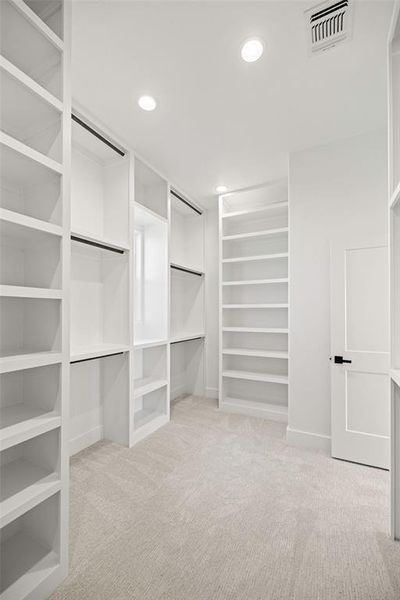 Walk in closet with carpet flooring and visible vents