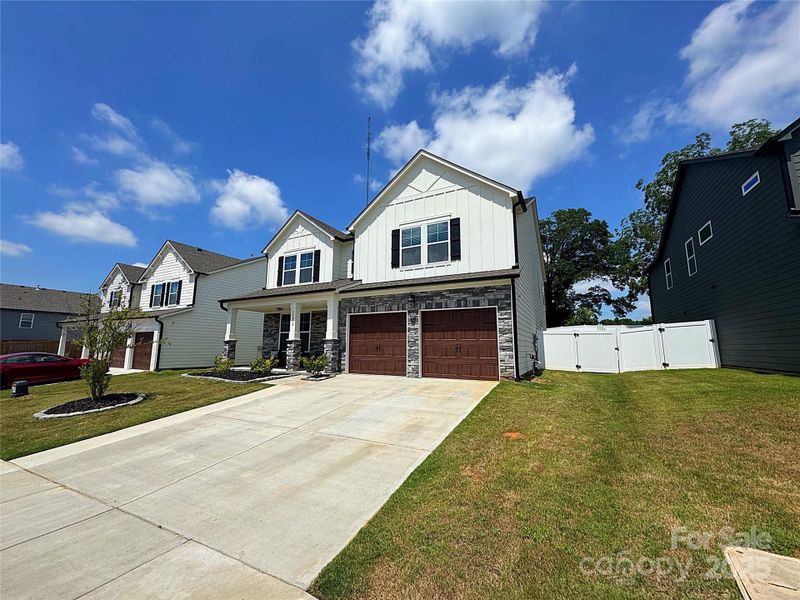 Front exterior of a new home in Enclave at Caldwell, Charlotte, NC, highlighting curb appeal (Image 20).
