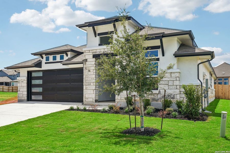 Front exterior of a new home in Veranda, San Antonio, TX, highlighting curb appeal (Image 2). Front exterior of a new home in Veranda, San Antonio, TX, highlighting curb appeal (Image 2).