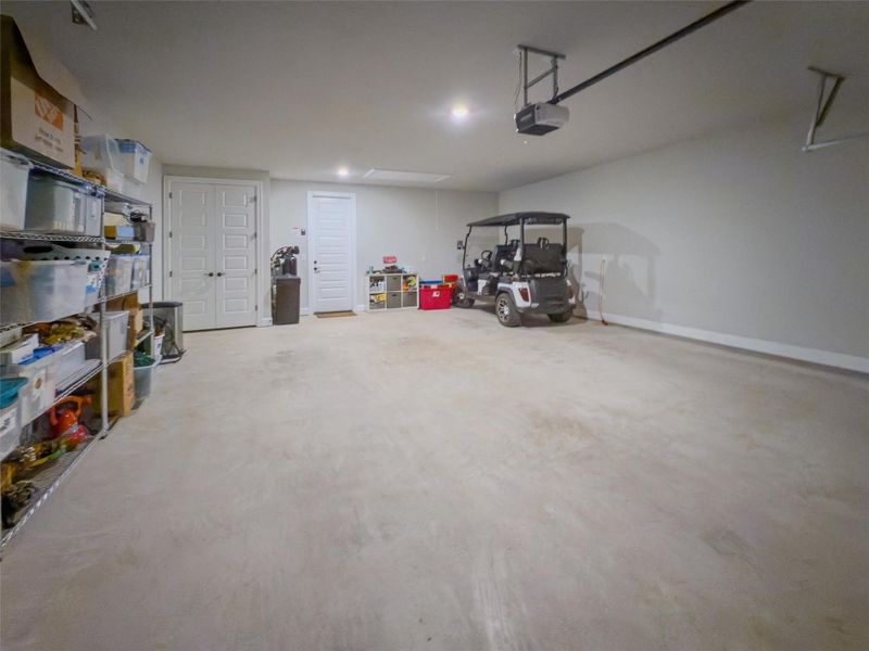 Oversize garage with an 8' deep extension to accomodate 2 golf carts plus 2 cars. Oversize garage with an 8' deep extension to accomodate 2 golf carts plus 2 cars.