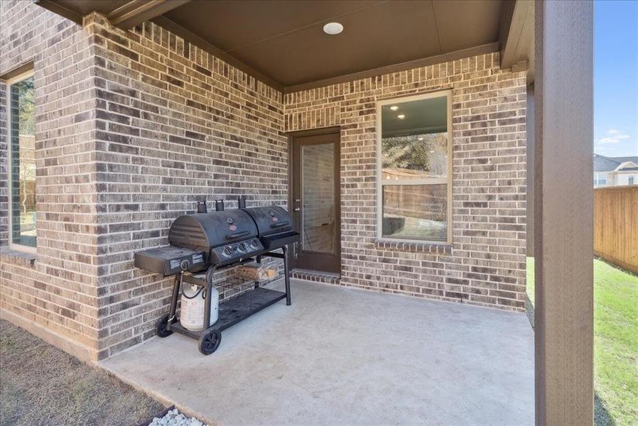 View of patio featuring area for grilling