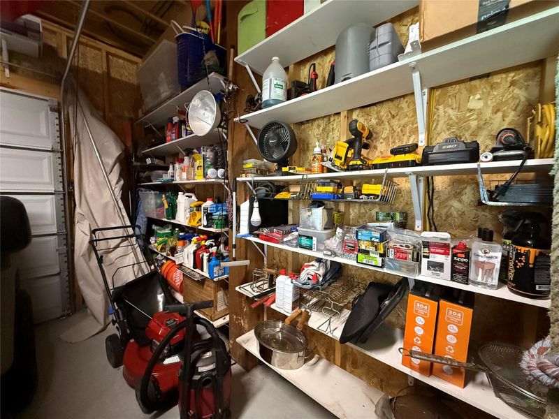 Shelving provided in garage area.