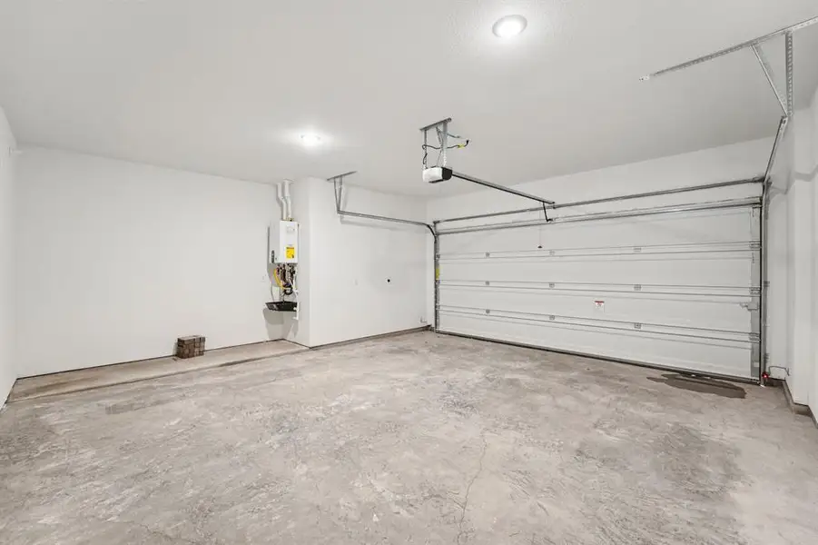 Finding a spacious 2-car garagein this area is a rare gem! (Sample photo of finishes and layout)