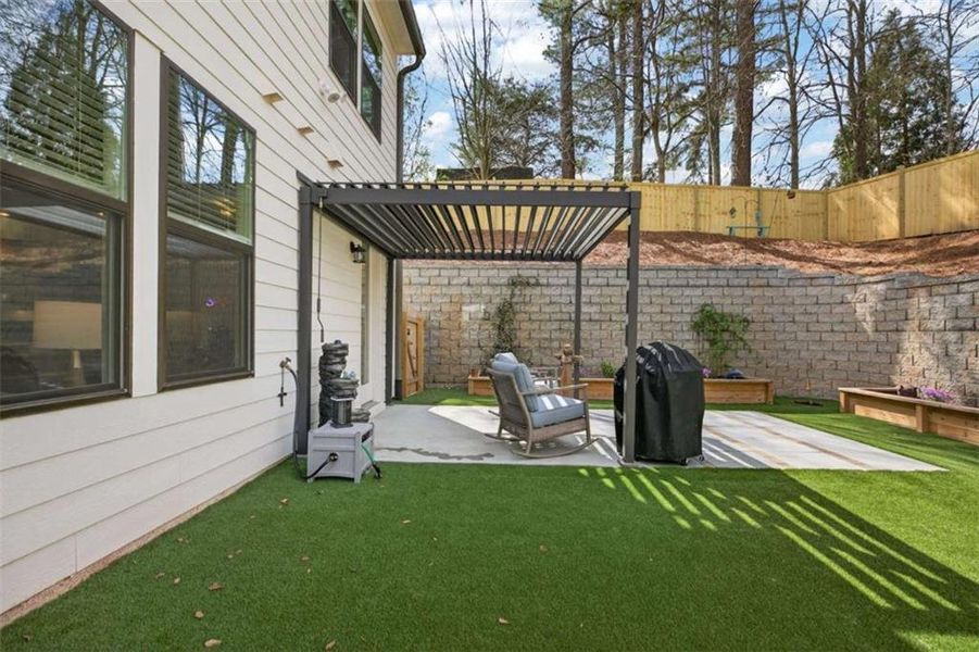 Exterior details and patio area of a home in The Village at Towne Lake, Woodstock (Image 27).