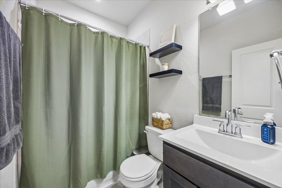 Guest bathroom offering a combined shower and bathtub. Guest bathroom offering a combined shower and bathtub.