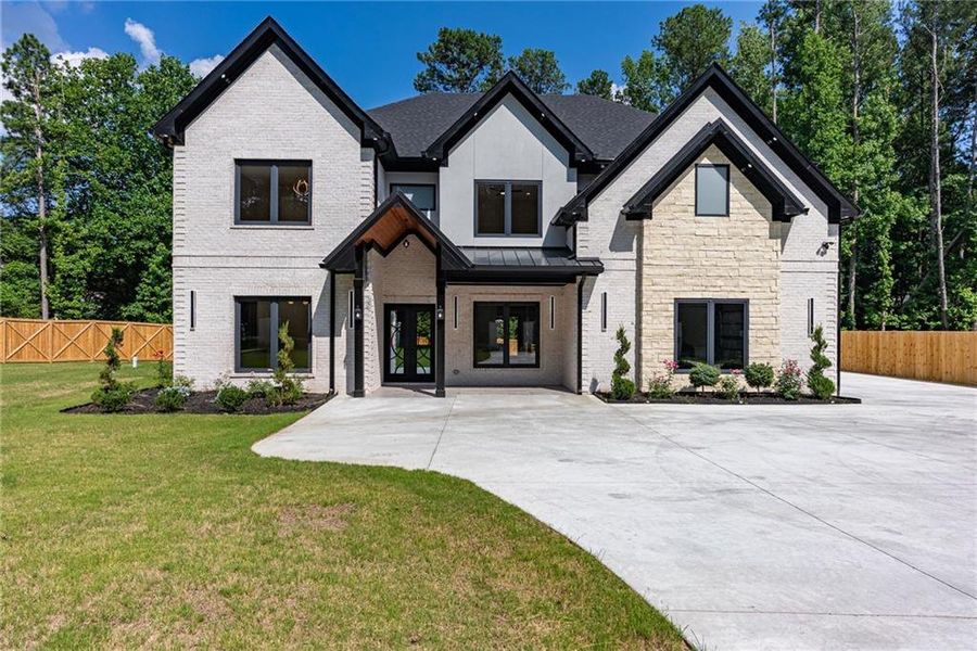 Front exterior of a new home in , Lawrenceville, GA, highlighting curb appeal (Image 48). Front exterior of a new home in , Lawrenceville, GA, highlighting curb appeal (Image 48).