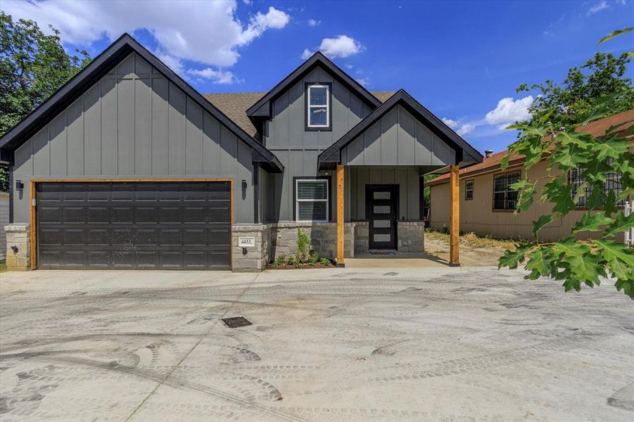 Modern farmhouse style home featuring a garage