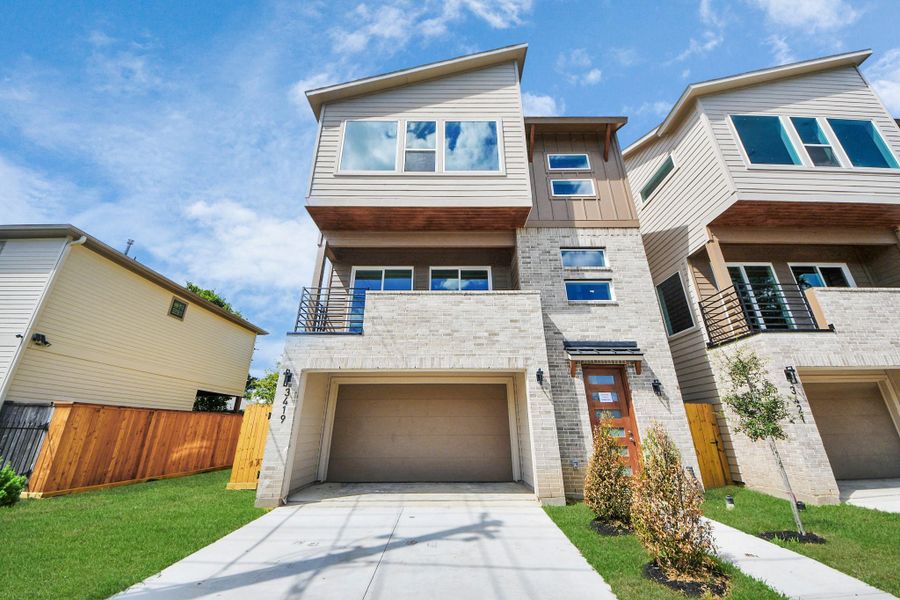 Front exterior of a new home in , Houston, TX, highlighting curb appeal (Image 24).