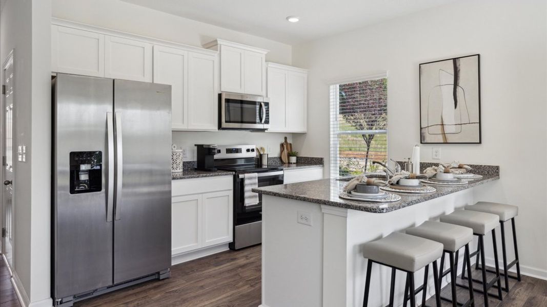 Representative furnished interior of a home built from the Altamont Townhome by D.R. Horton in Saint Marc's, Powell (Image 4).