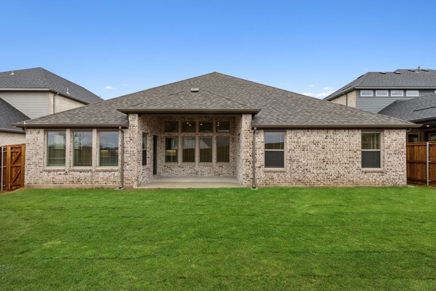 Covered Patio in the Gilmour II home plan by Trophy Signature Homes – REPRESENTATIVE PHOTO