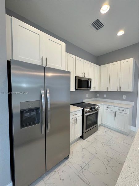 Furnished interior view inside a new home in , Lehigh Acres (Image 2).