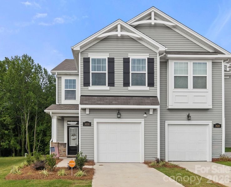Front exterior of a new home in Hedgecliff Townes, Concord, NC, highlighting curb appeal (Image 2). Front exterior of a new home in Hedgecliff Townes, Concord, NC, highlighting curb appeal (Image 2).