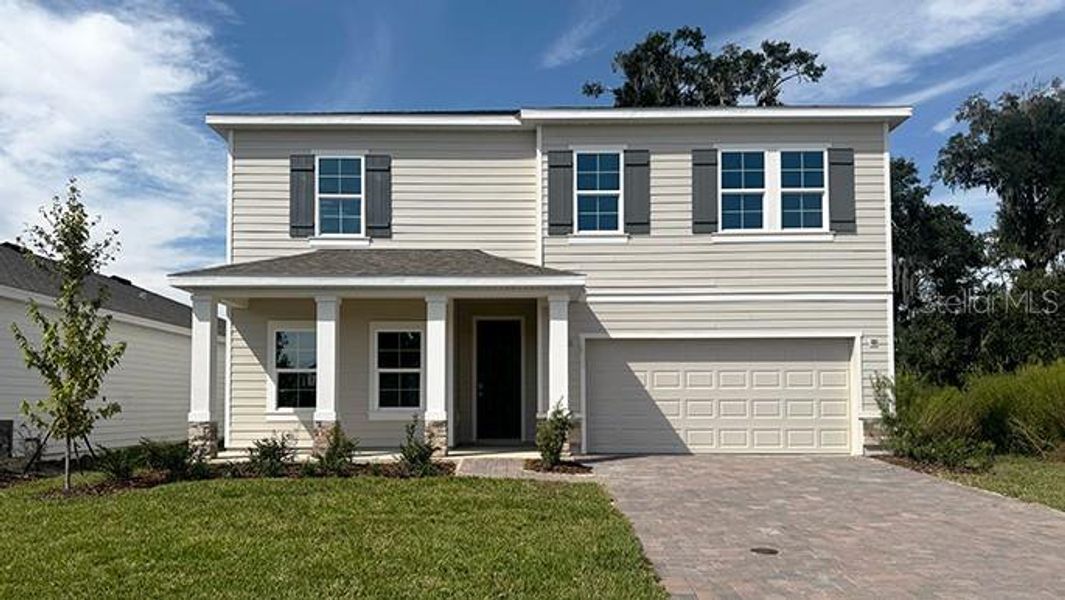 Front exterior of a new home in Buchanan Trails, Newberry, FL, highlighting curb appeal (Image 1). Front exterior of a new home in Buchanan Trails, Newberry, FL, highlighting curb appeal (Image 1).