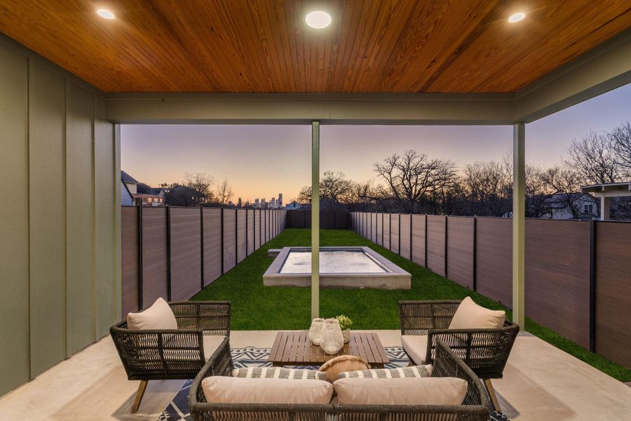 Fenced backyard featuring outdoor lounge area and a patio