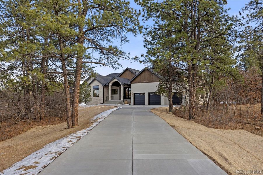 Front exterior of a new home in , Franktown, CO, highlighting curb appeal (Image 22).