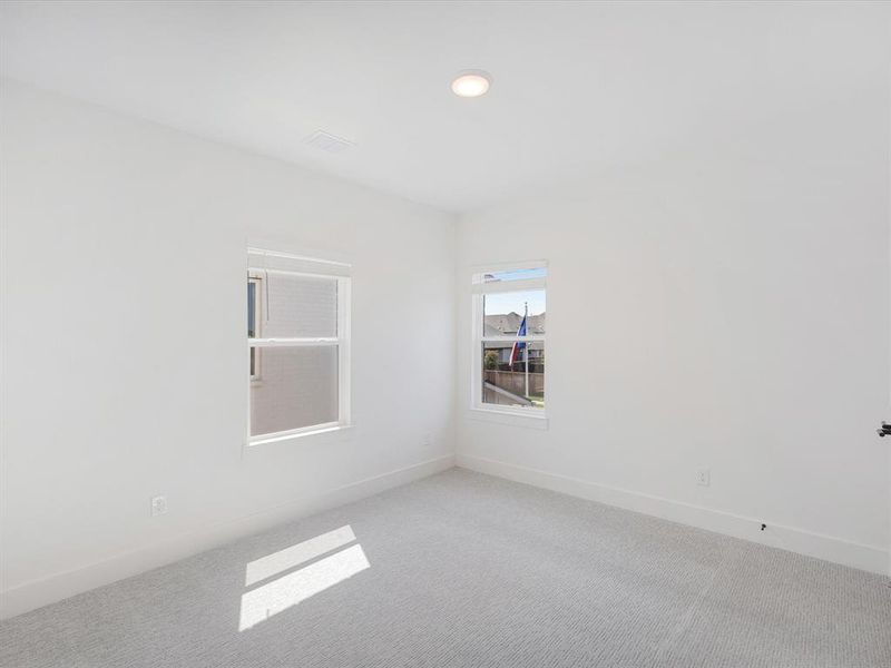 Empty room with carpet and recessed lighting Empty room with carpet and recessed lighting