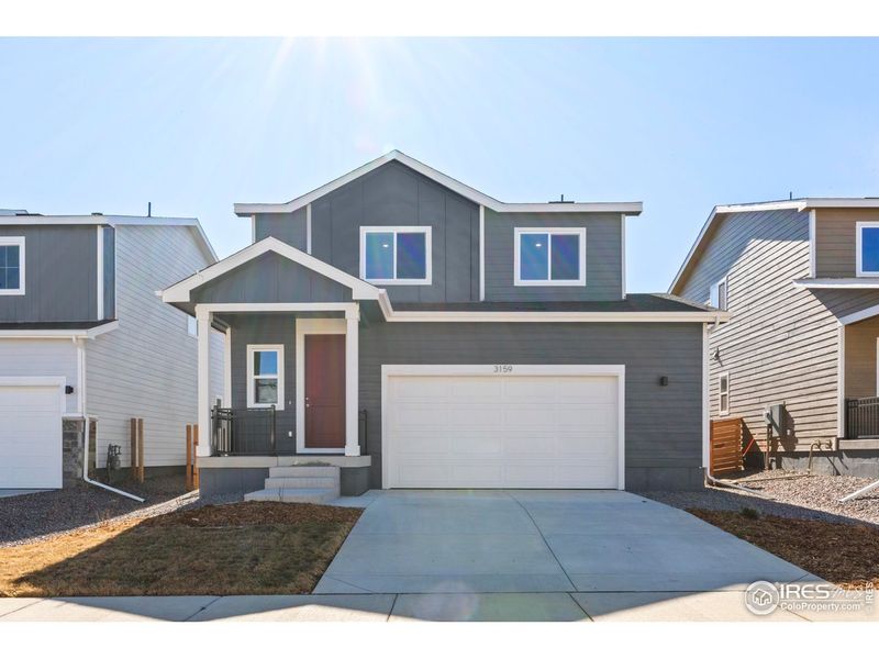 Front exterior of a new home in Bloom, Fort Collins, CO, highlighting curb appeal (Image 14).