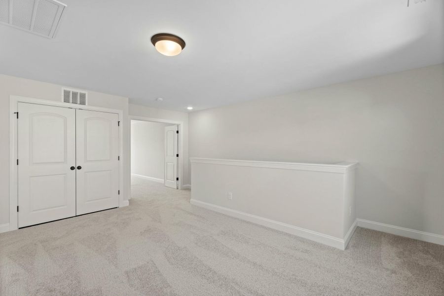 Spacious, unfurnished interior of a new home in Cottages at Piper Village, Trinity (Image 16).