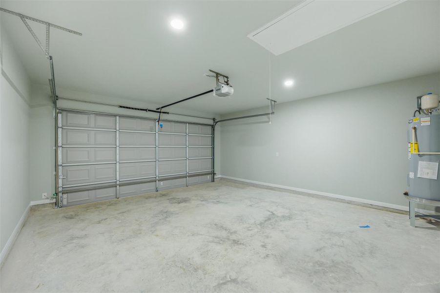 A spacious, pristine garage awaits, ready for vehicles and extra storage.