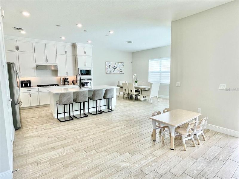 Furnished interior view inside a new home in Parkview Reserve, Orlando (Image 11).