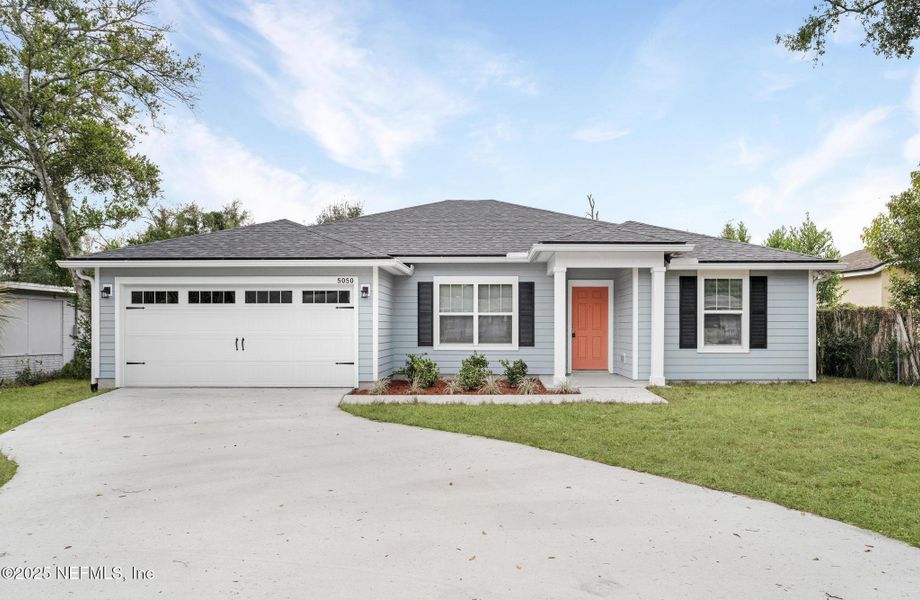 Front exterior of a new home in , Jacksonville, FL, highlighting curb appeal (Image 1). Front exterior of a new home in , Jacksonville, FL, highlighting curb appeal (Image 1).