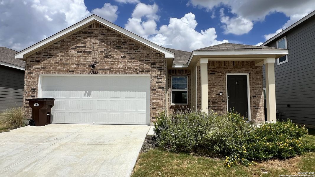 Front exterior of a new home in Trails at Culebra, San Antonio, TX, highlighting curb appeal (Image 1).
