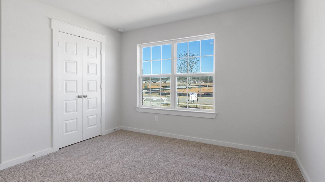 Representative furnished interior of a home built from the Blanton by Brightland Homes in Sunterra, Katy (Image 11).