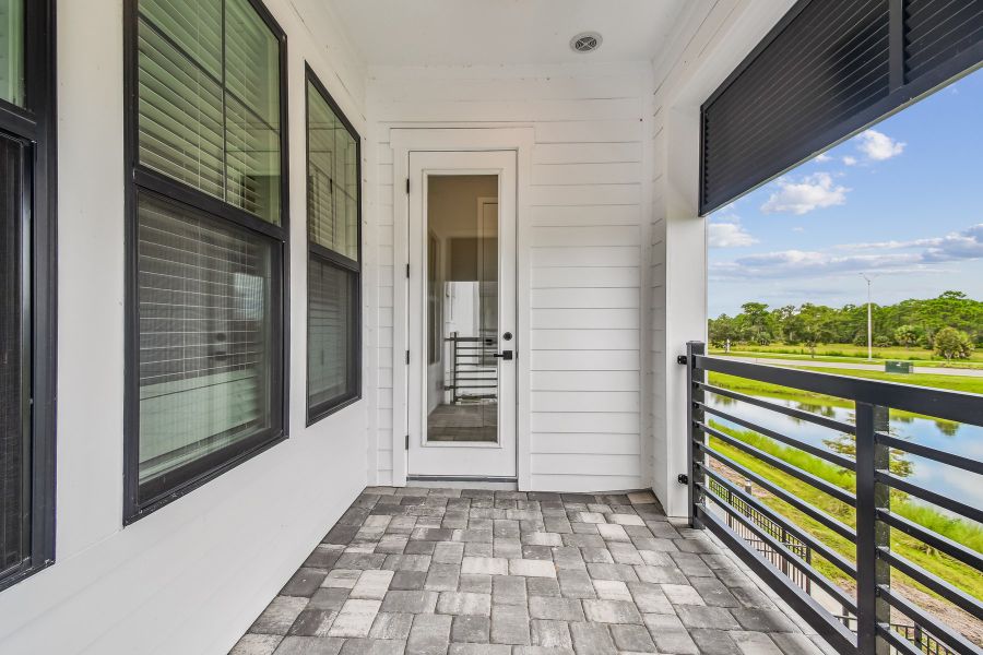Exterior details and patio area of a home in Emerald Landing at Waterside at Lakewood Ranch – City Homes, Sarasota (Image 4).