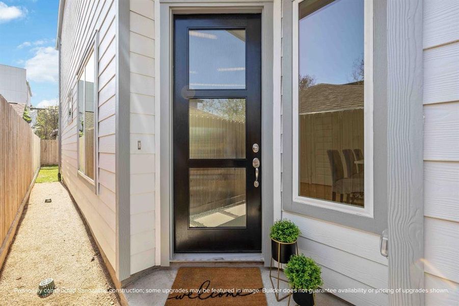 Step Inside: A welcoming 8-foot door greets your guests, or send friends through to the back if the BBQ has already started!