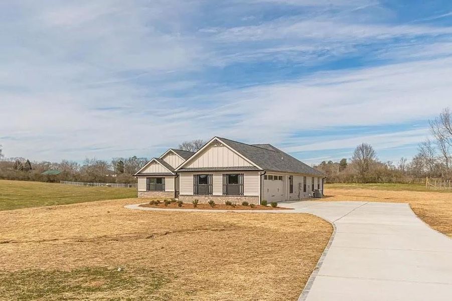 Front exterior of a new home in , Carrollton, GA, highlighting curb appeal (Image 18).