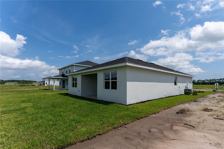 Exterior details and patio area of a home in The Palms at Venetian Bay, New Smyrna Beach (Image 16).