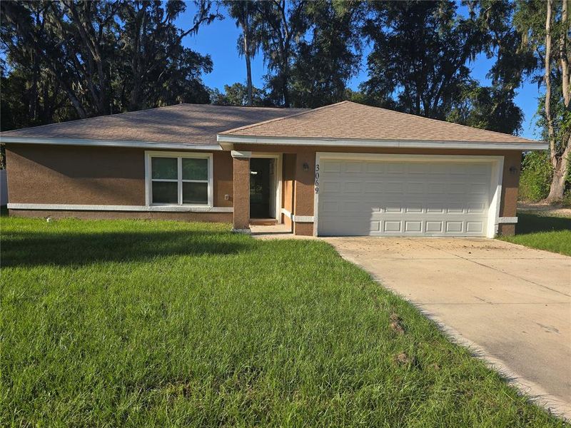 Front exterior of a new home in , Summerfield, FL, highlighting curb appeal (Image 2).