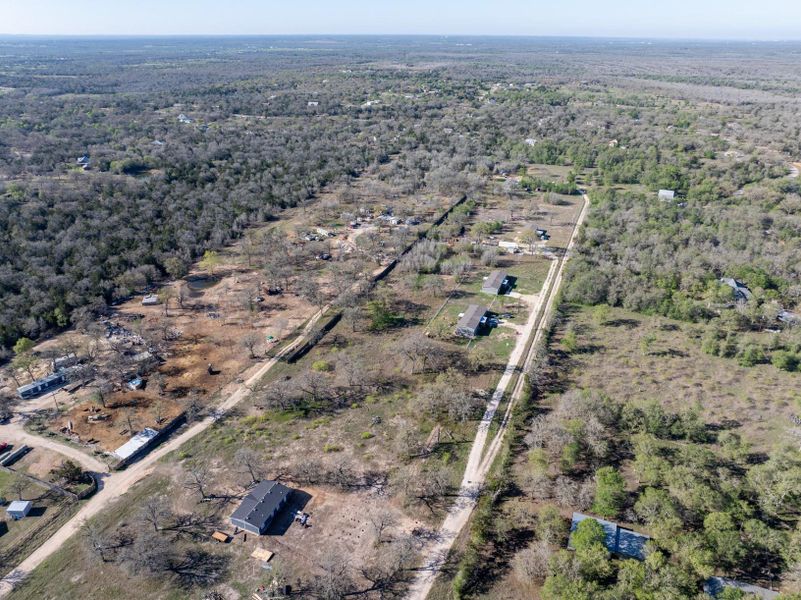 Aerial view of property's location featuring a forest Aerial view of property's location featuring a forest