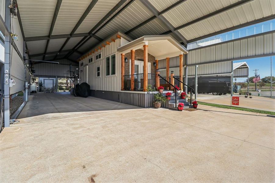 Side view of Park Model and large metal canopy Side view of Park Model and large metal canopy