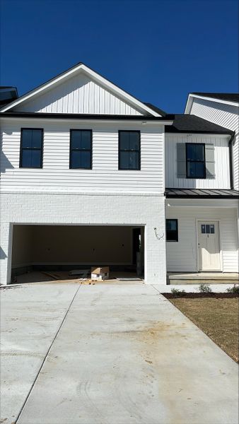 Front exterior of a new home in The Enclave, Greenville, NC, highlighting curb appeal (Image 1). Front exterior of a new home in The Enclave, Greenville, NC, highlighting curb appeal (Image 1).