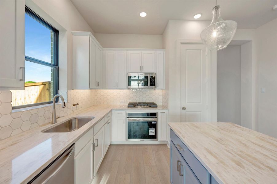 Furnished interior view inside a new home in Sienna - Landmark Row Collection, Missouri City (Image 9).
