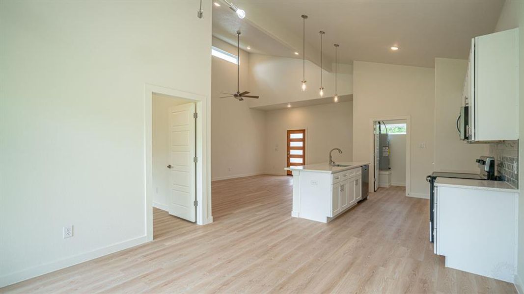 View from dining area into kitchen and living area