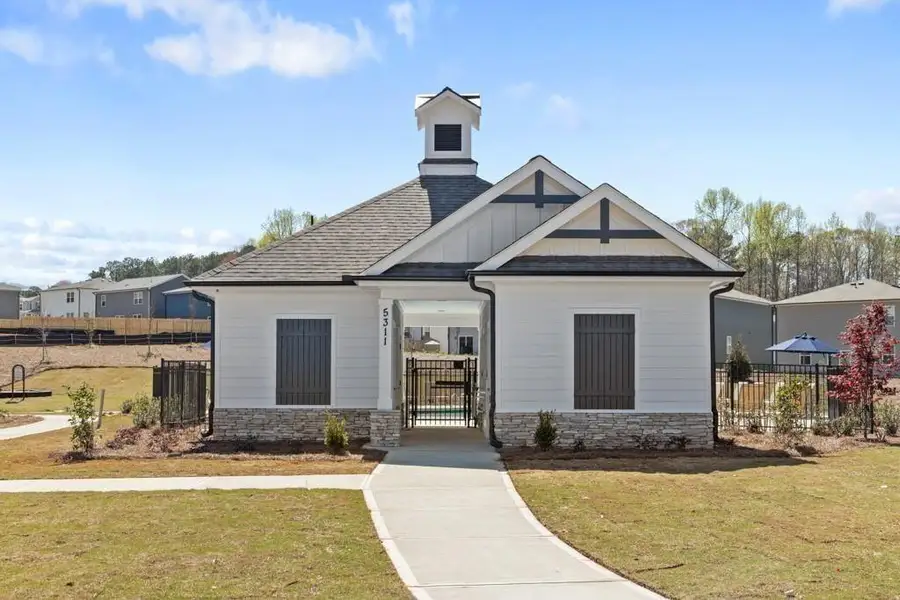 Front exterior of a new home in Union Heights, Flowery Branch, GA, highlighting curb appeal (Image 2). Front exterior of a new home in Union Heights, Flowery Branch, GA, highlighting curb appeal (Image 2).
