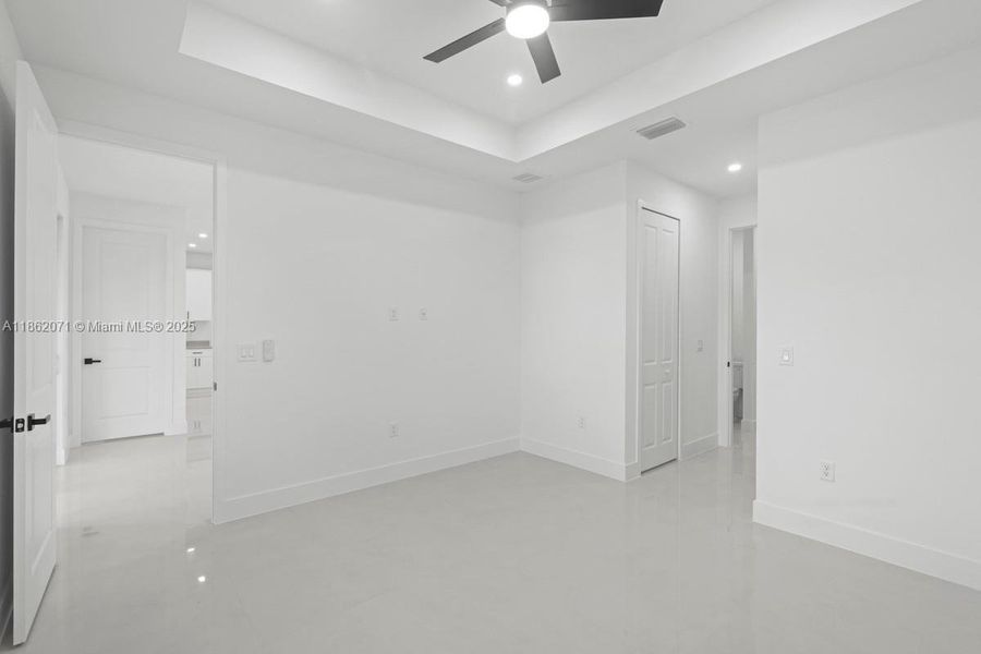 MAIN BEDROOM LOOKING TO ENTRANCE TO FOURTH BEDROOM