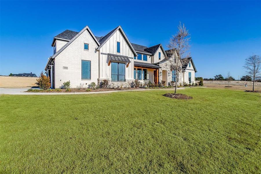 View of front of house with a front lawn