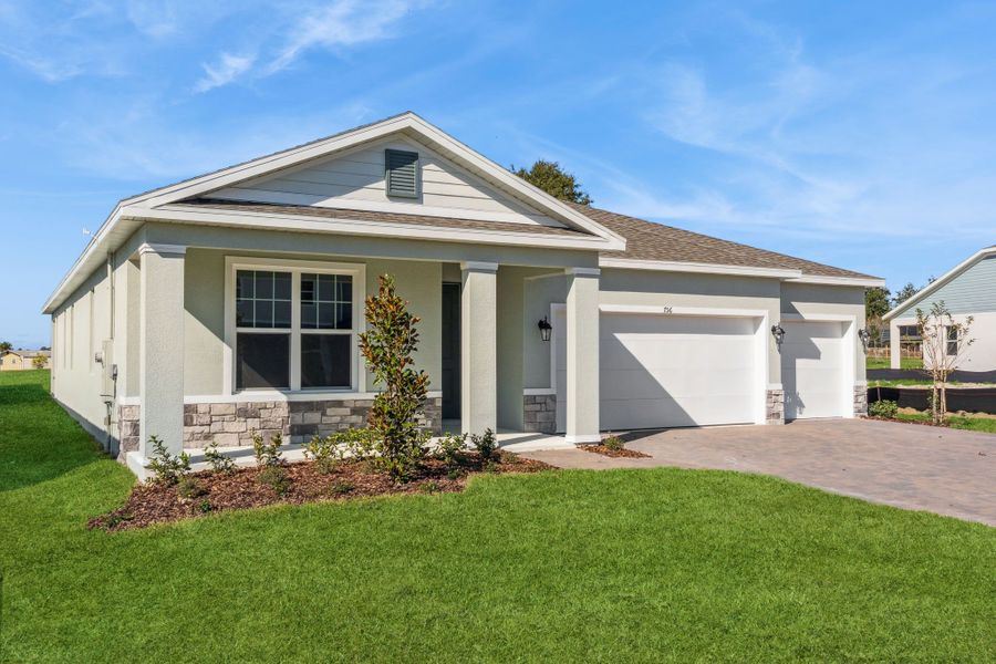 Front exterior of a new home in Eden Crest, Apopka, FL, highlighting curb appeal (Image 17).