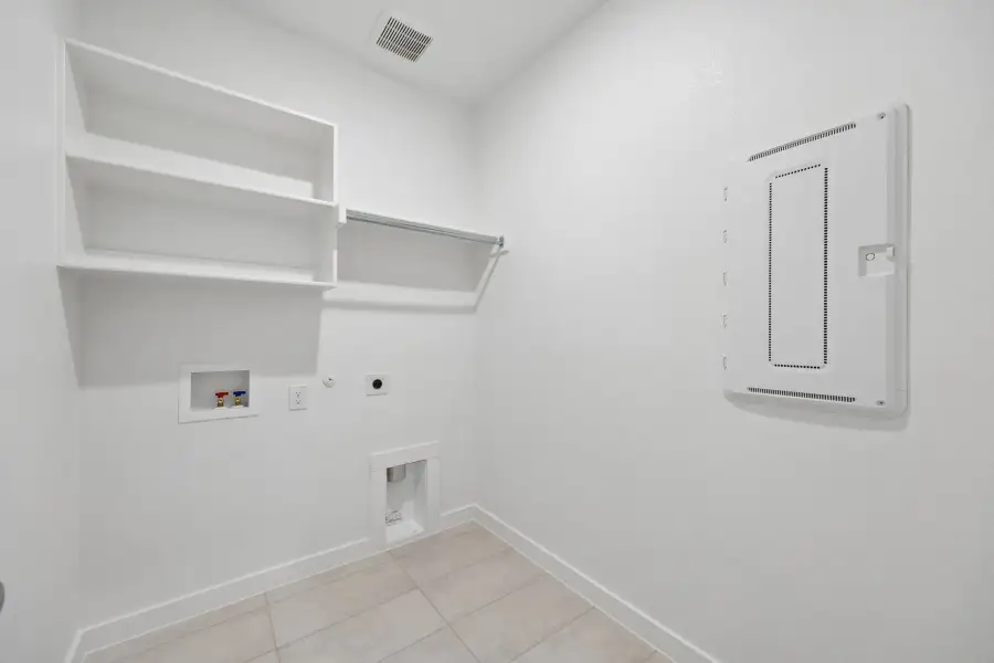 Utility Room in the Winters home plan by Trophy Signature Homes – REPRESENTATIVE PHOTO
