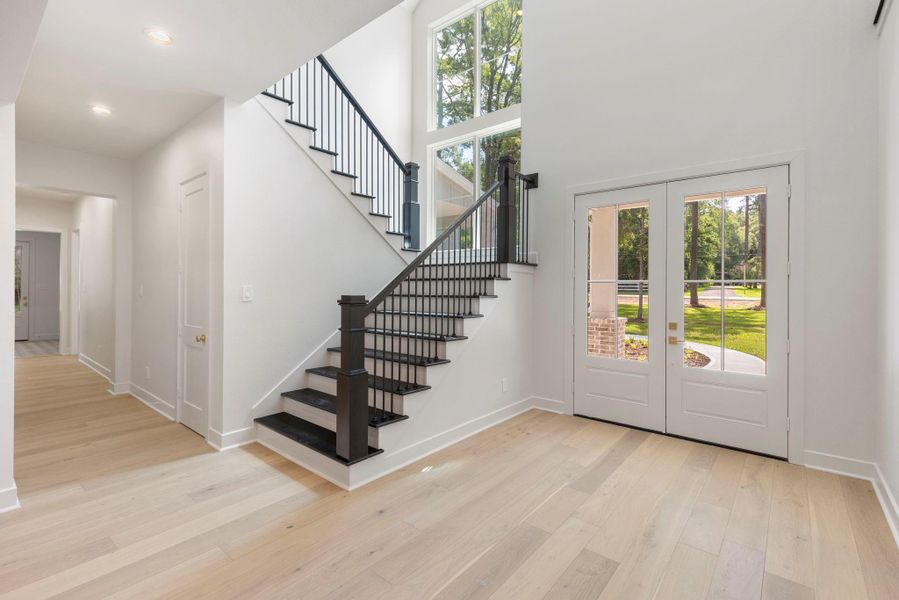 Beautiful light and bright entry showcases real wood flooring that flows throughout the downstairs. Beautiful light and bright entry showcases real wood flooring that flows throughout the downstairs.