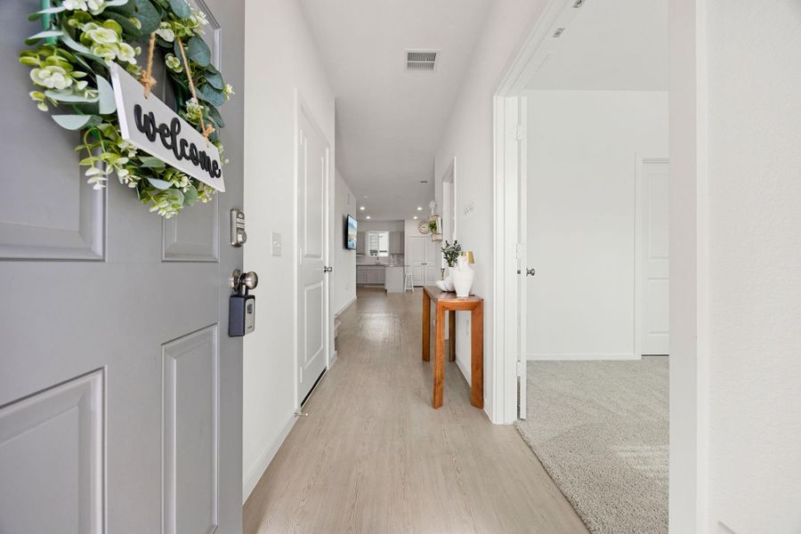 Step inside to a bright and welcoming entryway featuring durable flooring, neutral finishes, and a functional layout that flows seamlessly into the heart of the home.