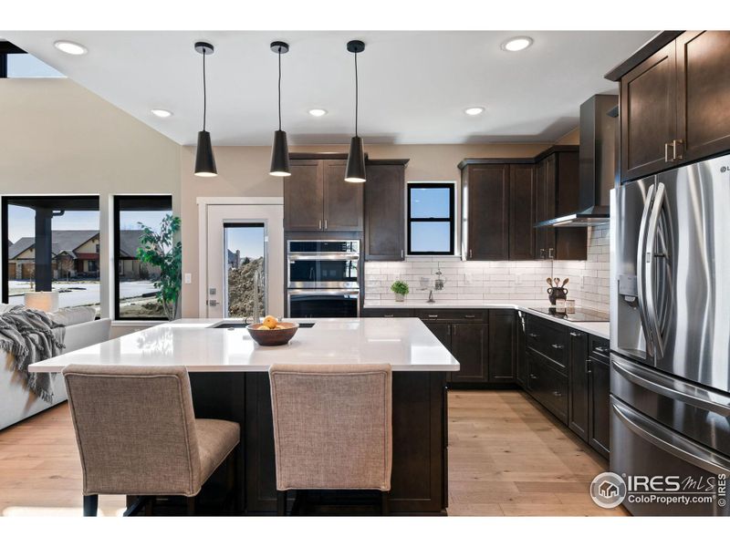hidden cabinets under the kitchen island provide additional storage for all your things.